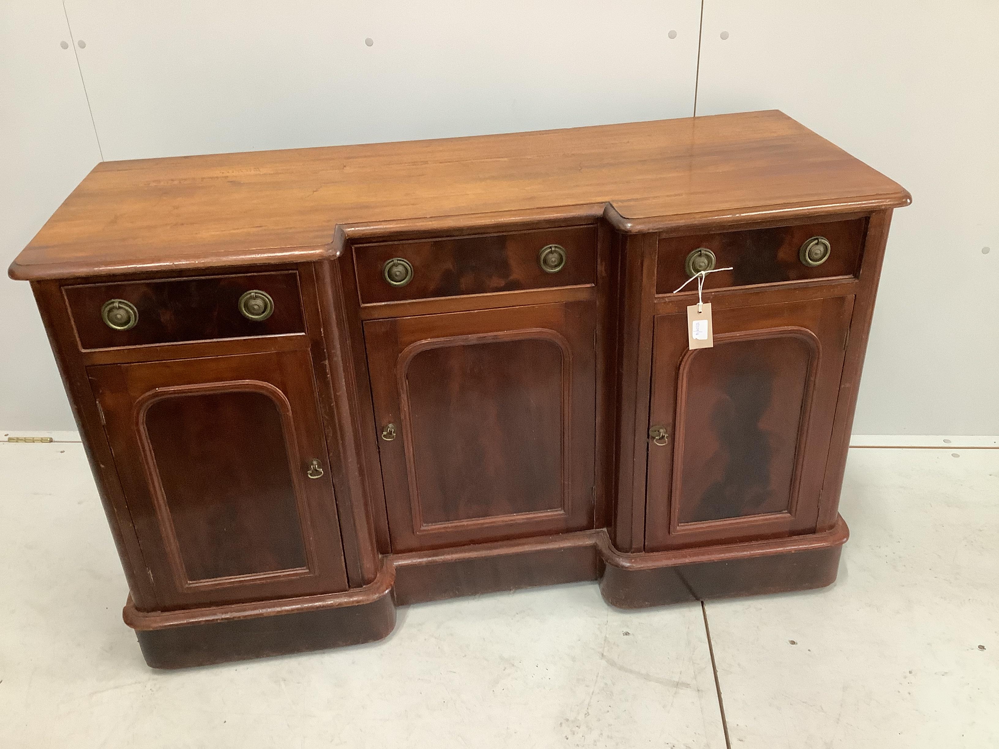 A Victorian inverse breakfront mahogany sideboard, width 124cm, depth 48cm, height 76cm